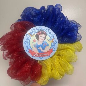 Hand Made Snow White Welcome Wreath with red yellow and blue ribbon